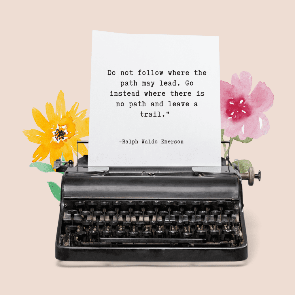 Typewriter and flowers with the quote, "Do not follow where the path may lead. Go instead where there is no path and leave a trail"