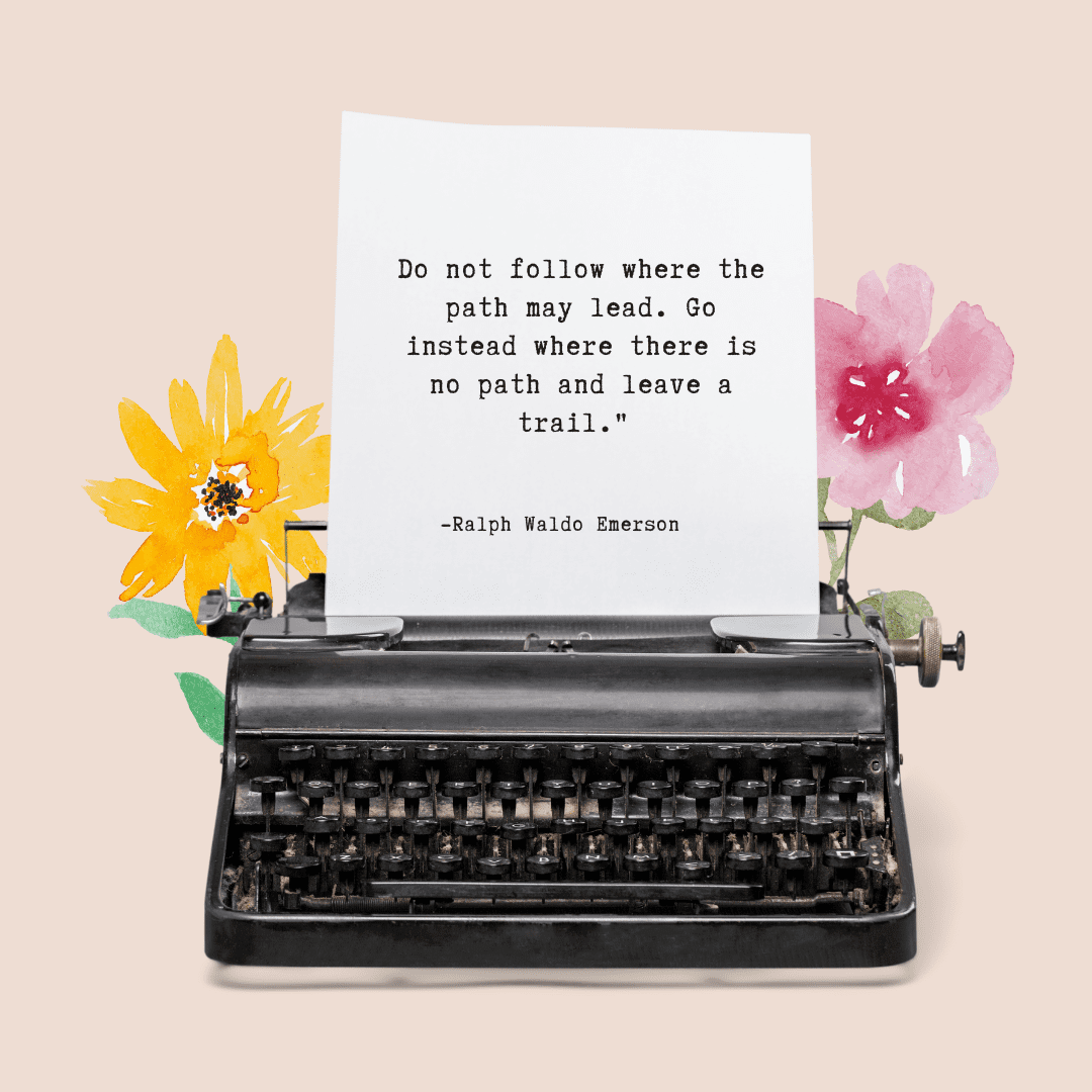 Typewriter and flowers with the quote, "Do not follow where the path may lead. Go instead where there is no path and leave a trail"